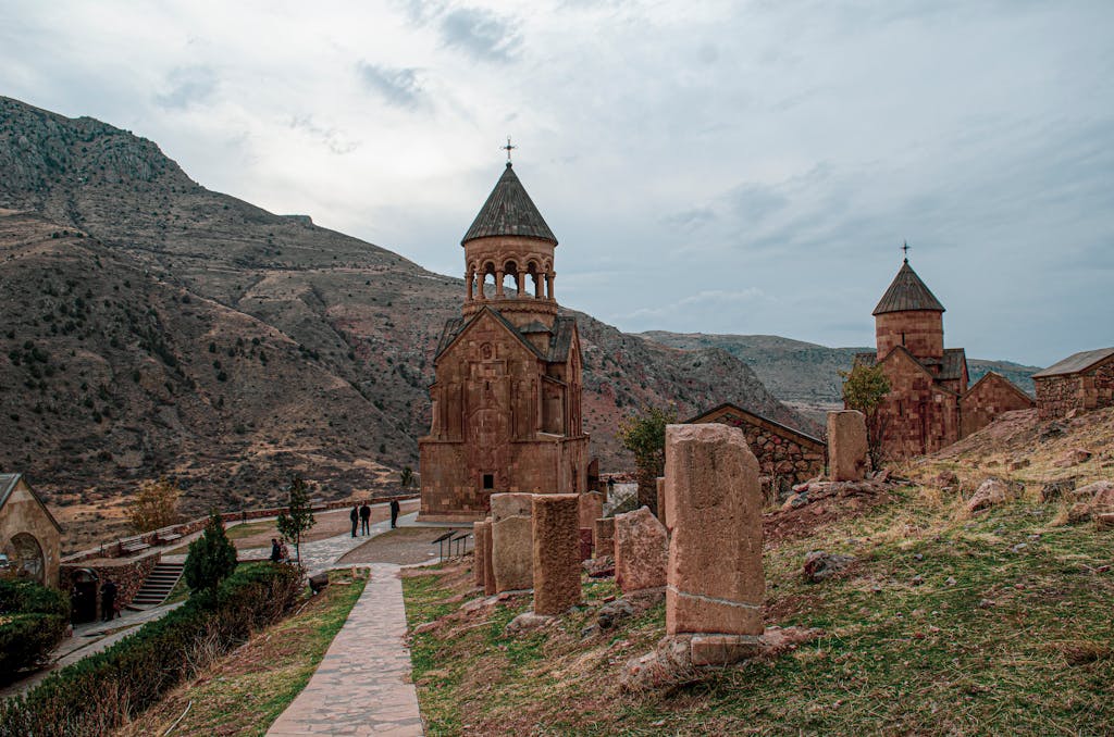 Explore the historic Armenian monastery nestled in a serene mountainous landscape, echoing the past.